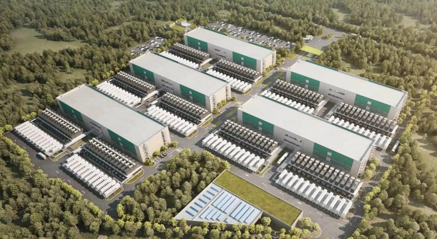 Vista aérea del campus de Server Farm con cinco edificios rodeados de bosque verde